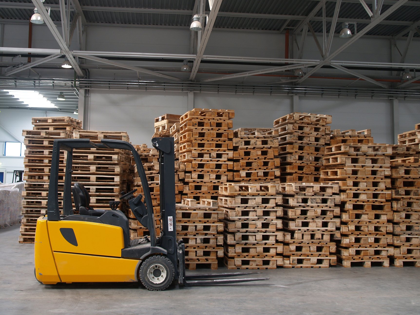 A forklift with piles of crates